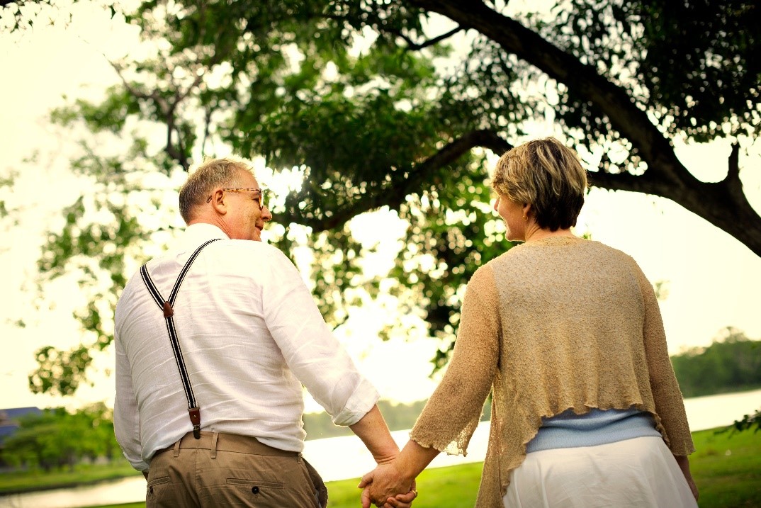Mature couple holding hands