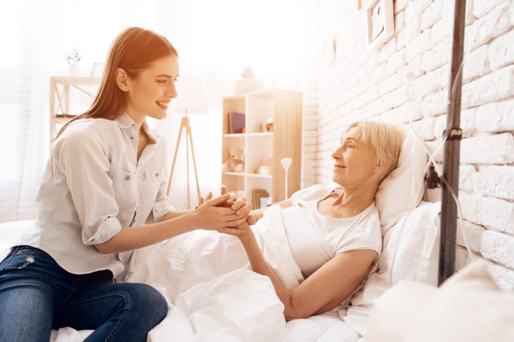 Daughter with mother in bed