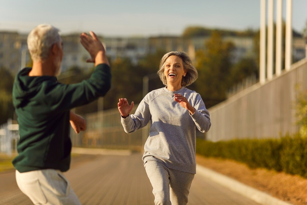 Happy senior couple running