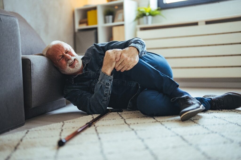 An injured senior man fallen.